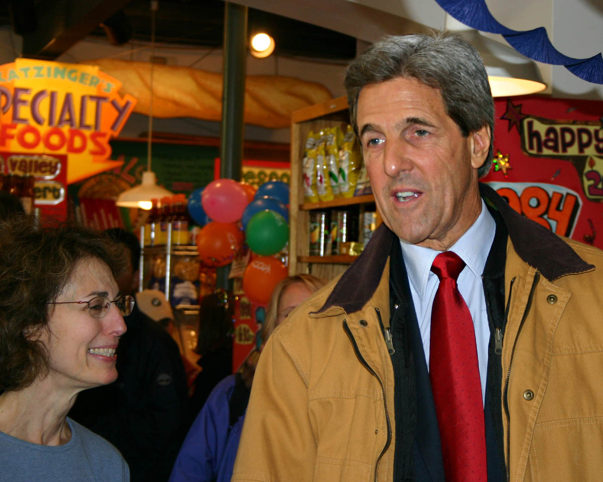 Katzinger's co-owner Diane Warren speaks with John Kerry inside the deli.